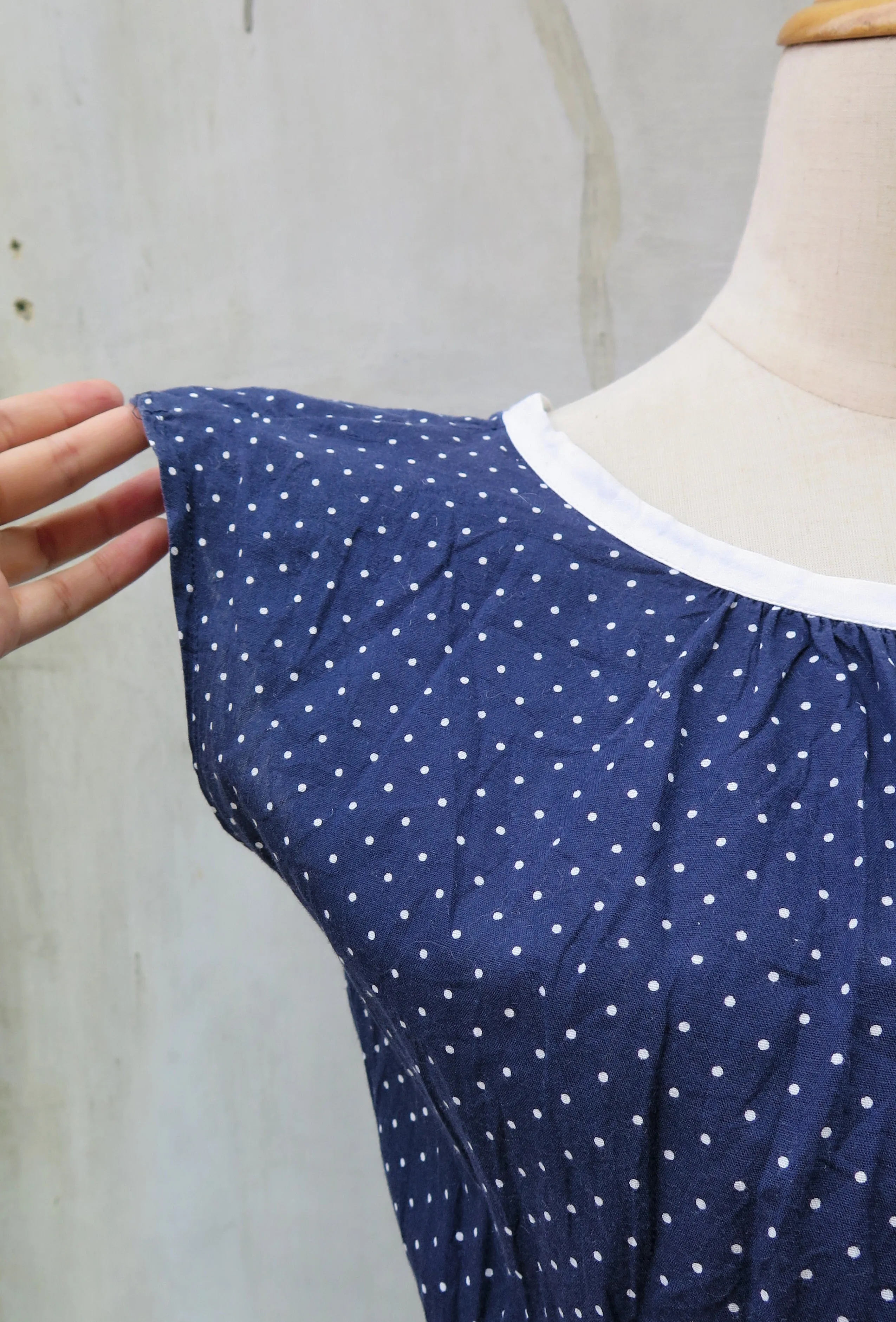 Winifred | Vintage 1950s 1960s V-back white navy blue tiny polka dot print swing style dress